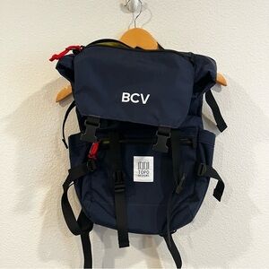 Topo Designs navy blue and yellow/green interior accents fold over backpack